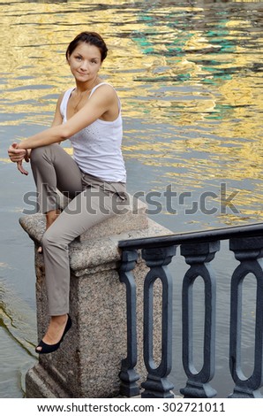beautiful girl posing, walking in the city. summer, heat. \
sunny day