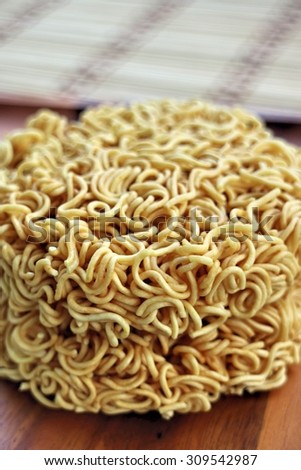 Instant noodles on wooden plate