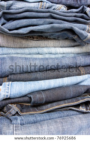 close up of a pile of different jeans to use as a background