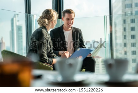 Similar – Image, Stock Photo Meet in the tower. All tables and windows are occupied. The sun goes down and the celebration is without Corona.