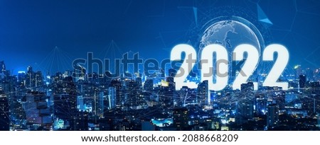 New year 2022 or start straight concept.Modern city with wireless network connection.Connection technology with city background at night,hope,new life change,business strategy,opportunity concept.