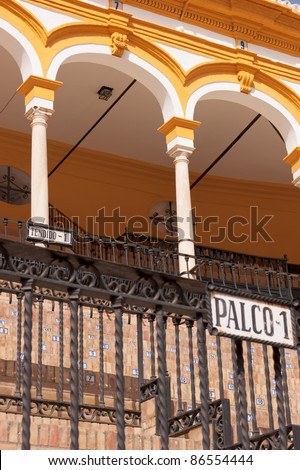 Detail of the bullring in Sevilla. Seats are identified by small numbered tides. Selective focus, shallow DOF