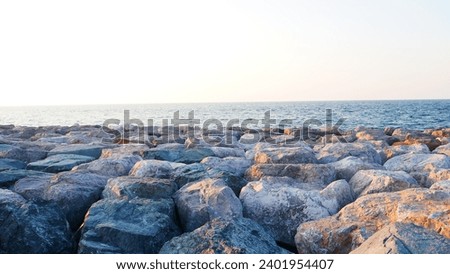 Image, Stock Photo Picturesque seaside with rocks at bright sunset