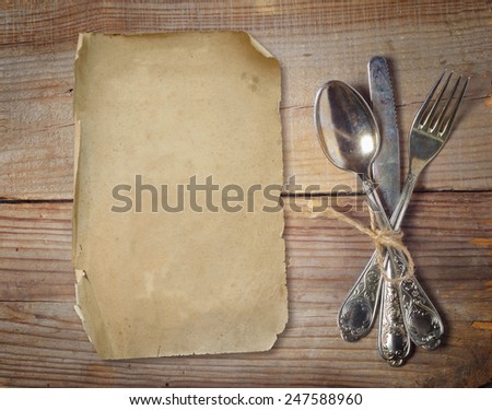 old cutlery on wooden table