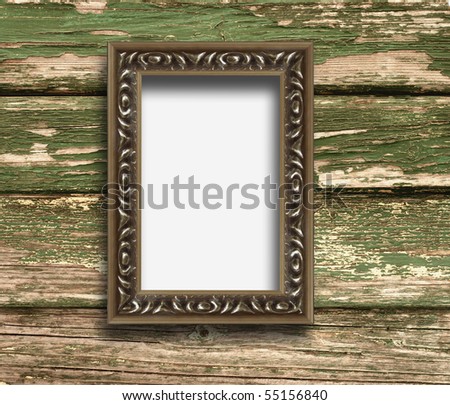 Old frame on a wooden background