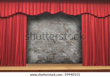 Small stage with red velvet theater curtains
