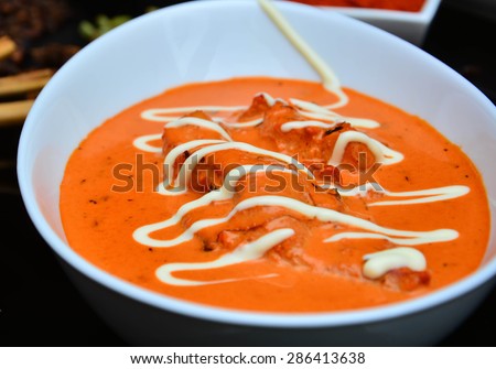 Indian Butter Chicken from Indian Restaurant served in white bowl