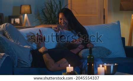 Similar – Image, Stock Photo Diverse couple chilling on floats