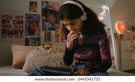 Similar – Image, Stock Photo teenager looks at her mobile phone