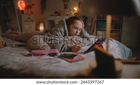Similar – Image, Stock Photo A teenage girl does makeup and shows how to apply blush while recording video for her blog on her smartphone on a tripod at home
