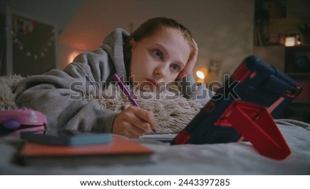 Similar – Image, Stock Photo A teenage girl does makeup and shows how to apply blush while recording video for her blog on her smartphone on a tripod at home