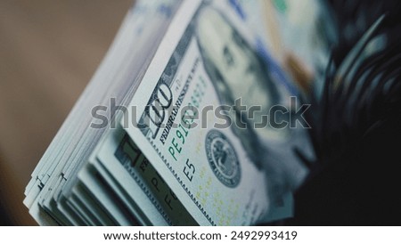 Similar – Image, Stock Photo Dollar banknotes on a wooden table