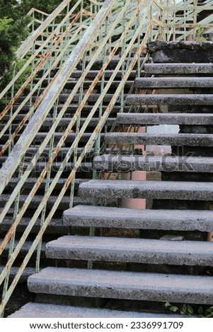 Similar – Foto Bild alte rostige Treppe mit Schäden gegen den blauen Himmel und die Wolken