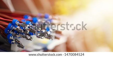 Bundle of crimped cables with electrical connectors. Terminated wire ready to creation connection. Industrial background with copy space for text, soft color effect, banner format Photo stock © 