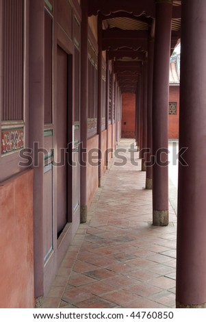 Dark red pillar along the corridor