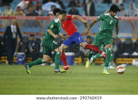 SYDNEY AUSTRALIA-JANUARY 2015, Park Joo Hoo (7) & Ahmed Ibrahim (2) in action during the AFC Asian Cup match between Korea Repblic and Iraq at the ANZ Stadium, Sydney, on 26 January 2015, in Australia