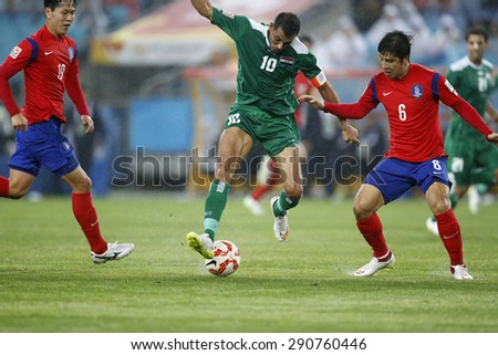 SYDNEY AUSTRALIA-JANUARY 2015, Younus Mahmood (10) Park Joo Ho (6) in action during the AFC Asian Cup match between Iraq and Korea Republic at the ANZ Stadium, Sydney, on 26 January 2015, in Australia