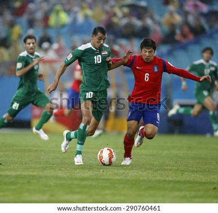 SYDNEY AUSTRALIA-JANUARY 2015, Younus Mahmood (10) Park Joo Ho (6) in action during the AFC Asian Cup match between Iraq and Korea Republic at the ANZ Stadium, Sydney, on 26 January 2015, in Australia
