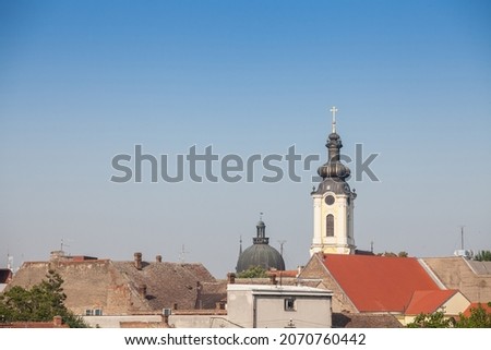  Panorama of the city center of Sremska Mitrovica, Serbia, with houses roofs and the clocktower steeple arhiv, the Vmuc Dimitrije orthodox church with its typical austro hungarian baroque architecture Imagine de stoc © 
