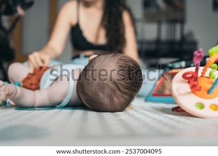 Similar – Image, Stock Photo Happy faceless mother playing with baby in bedroom