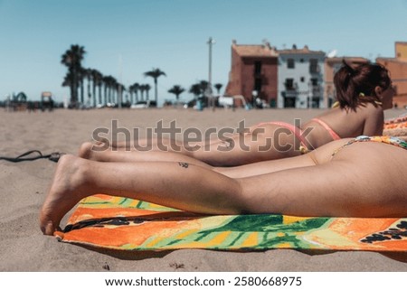 Similar – Image, Stock Photo Anonymous woman sunbathing on rocky beach