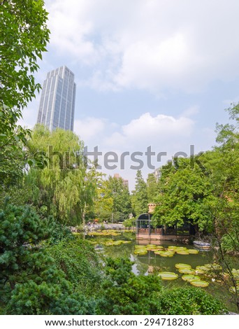Buildings and Nature contrast at People\'s square in the center of Shanghai, China