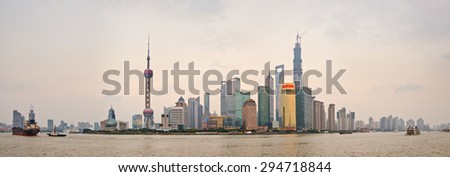 SHANGHAI, CHINA - OCTOBER 20, 2013: Panoramic view of Lujiazui and financial district skyscrapers from the Bund, in Shanghai, China, at sunset