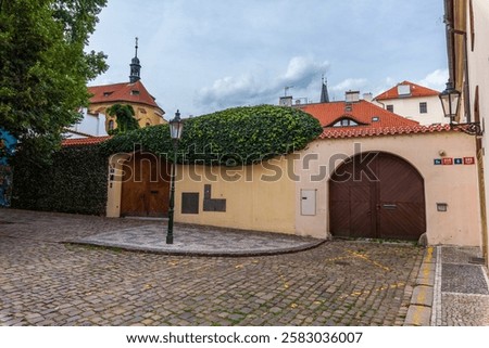 Similar – Image, Stock Photo large wooden gate with plain door handle, slanted wooden boards and painted with different green paint, which is peeling off