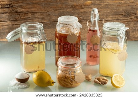 Similar – Image, Stock Photo Fermented lemons in jars of salt, chili pepper and rosemary. Probiotics Fermented food. Pickled lemons.