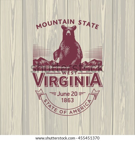 West Virginia Mountain State, stylized emblem of the state of America, bear, black, on wooden background