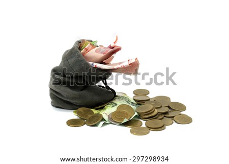 Coins and cash in a cloth bag isolated white background.