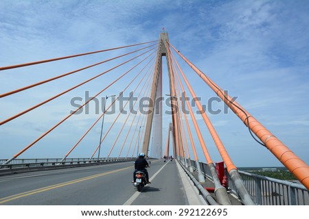 CAN THO CITY, VIETNAM - JUN 28, 2015: Traffic on Can Tho cable-stayed bridge in Can Tho, southern Vietnam. The bridge is currently the longest main span cable-stayed bridge in Southeast Asia.