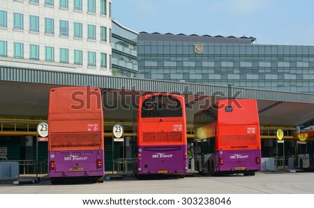 Singapore - Jul 24, 2015. Public commuter buses at a busy bus terminal in Singapore. SBS Transit is a bus and rail operator in Singapore and carries close to three million passengers daily.