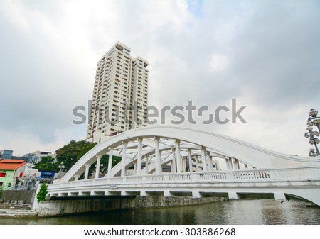 SINGAPORE - JUL 5, 2015. Elgin bridge, made in 1929, over the Singapore River in district Riverside. Bridges over the Singapore River are important in the city\'s infrastructure.
