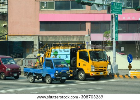 Taichung, Taiwan - Mar 15, 2015. Many cars on street in Taichung. Taichung has a population of over 2.7 million people, making it the third largest city.