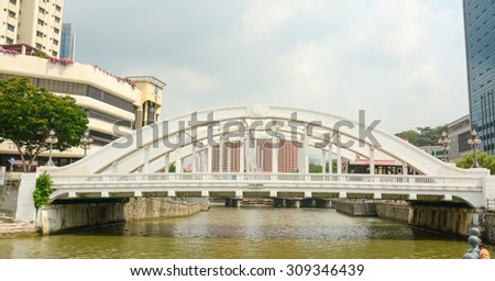 SINGAPORE - JUL 5, 2015. Elgin bridge, made in 1929, over the Singapore River in district Riverside. Bridges over the Singapore River are important in the city\'s infrastructure.
