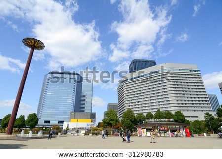 OSAKA JAPAN - APRIL 24, 2015. Modern buildings in Osaka, Japan. Osaka is the third largest city and an economic hub of Kansai region.