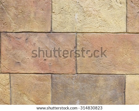 Stone wall background in the modern buildings in Delhi, India.