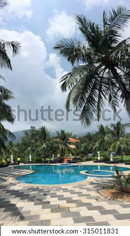 Phuket, Thailand - May 15, 2015: Beautiful swimming pool in tropical resort, Phuket, south of Thailand. Phuket is home to many high-end seaside resorts, spas and restaurants.