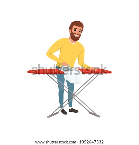 Smiling man ironing clothes on an ironing board. Cartoon house husband. Young guy in yellow sweater and blue jeans. Housekeeping theme. Flat vector design