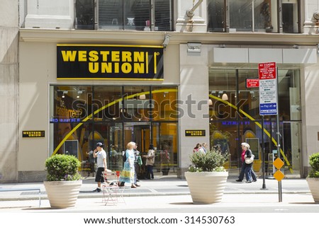 New York, New York, USA - May 1, 2011: The exterior of a Western Union store on Broadway above 40th street in Manhattan. Pedestrians can be seen.