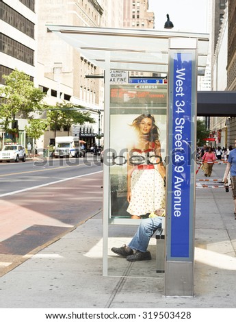 New York, New York, USA - June 20, 2011: This is a modern New York City bus stop. It has a display which shows when the next buses are due to arrive.