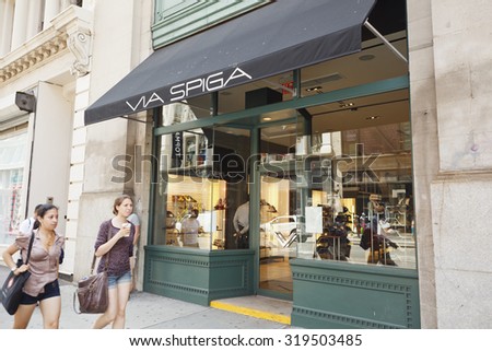 New York, New York, USA - June 20, 2011: People walk in front of the Via Spiga store on Broadway in the Soho section of Manhattan. Via Spiga is a maker of designer shoes/accessories for men and women