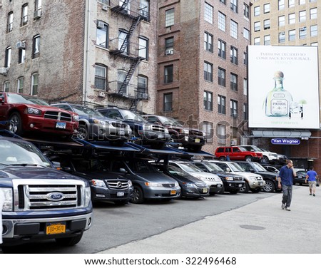 New York, New York, USA - July 14, 2011: A small multi-level parking lot on Lafayette Street below Prince Street in lower Manhattan. Parking space is scarce in Manhattan.