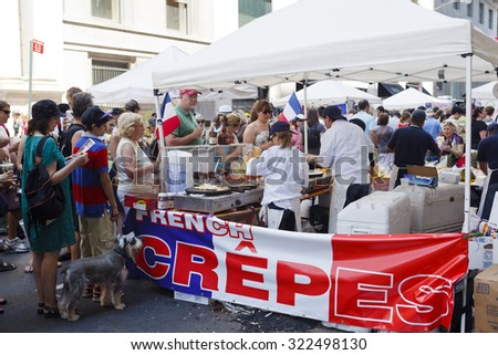 New York, New York, USA - July 10, 2011: A stand serving Crepes at The Bastille Day street fair. This three block long street fair celebrates French culture. There are many booths.