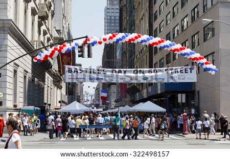 New York, New York, USA - July 10, 2011: The Bastille Day on 60th Street street fair as seen from 5th Avenue looking east across 60th street. This three block long fair celebrates French culture.