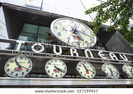 New York, New York, USA - May 30, 2012: Tourneau clocks and signage over Tourneau Time Machine on in Midtown Manhattan.  Tourneau is a leading retailer of fine watches with stores throughout the US.