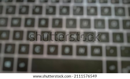 Defocused abstract background of laptop keyboard.