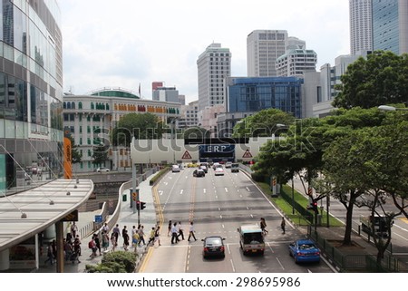 SINGAPORE - June 19: Typical urban traffic, along Orchard Road, a major shopping area in downtown Singapore, during the holidays.June 19, 2015 in Singapore.