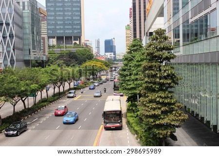 SINGAPORE - June 19: Typical urban traffic, along Orchard Road, a major shopping area in downtown Singapore, during the holidays.June 19, 2015 in Singapore.
